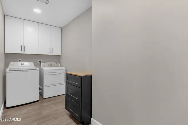 a bathroom with a granite countertop sink mirror and vanity