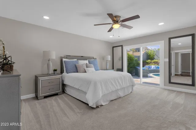 a bedroom with a bed and a lamp