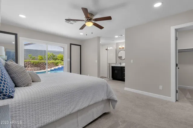 a bathroom with a toilet a sink and a mirror