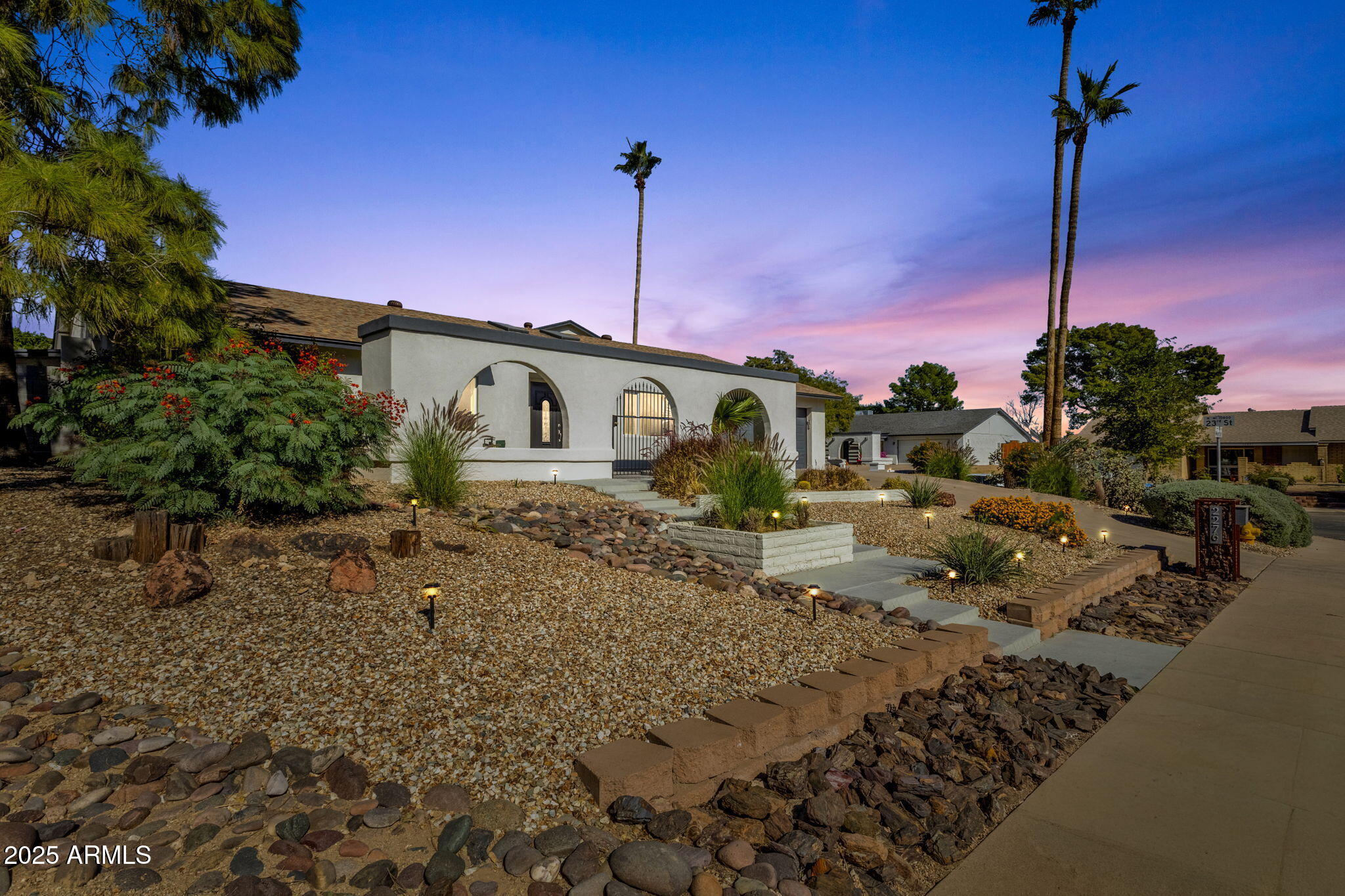 2276 East Mercer Lane Phoenix, AZ 85028 - Photo 4 of 61 a front view of a house with a yard