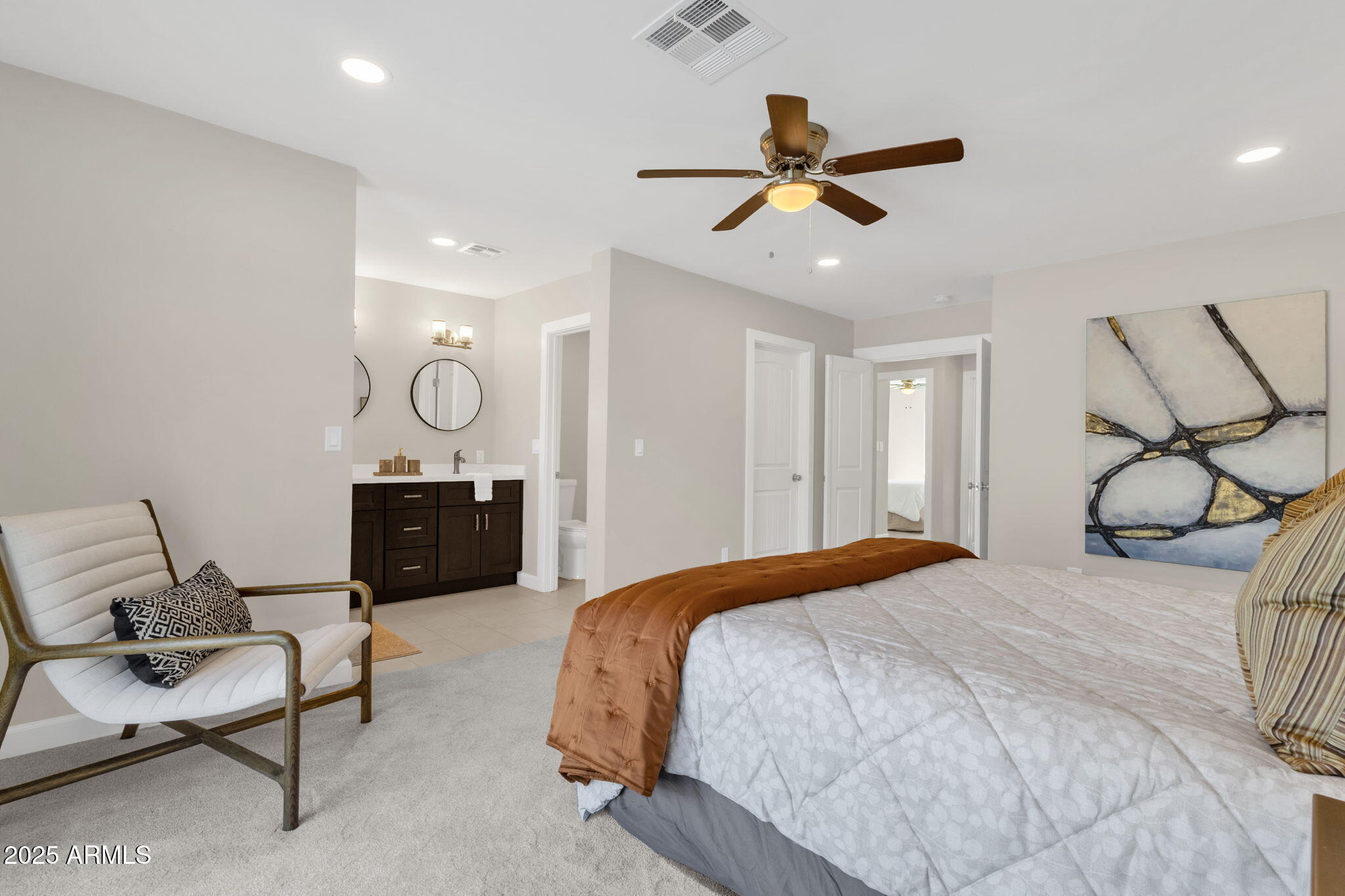 2276 East Mercer Lane Phoenix, AZ 85028 - Photo 49 of 61 a bedroom with a bed mirror couch and a ceiling fan