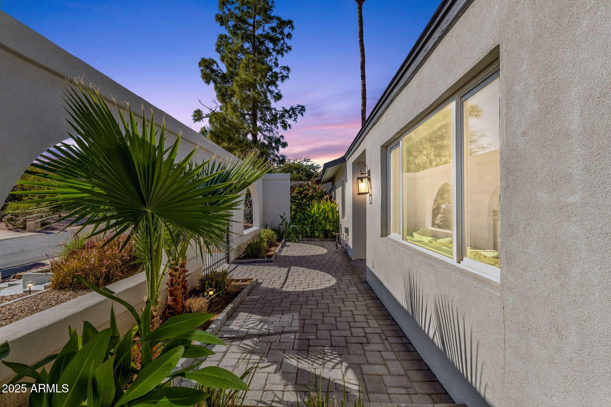 2276 East Mercer Lane Phoenix, AZ 85028 - Photo 5 of 61 a view of a backyard with potted plants