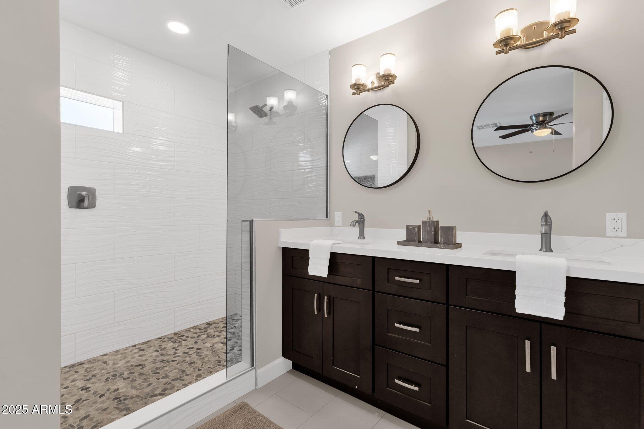 2276 East Mercer Lane Phoenix, AZ 85028 - Photo 51 of 61 a bathroom with a double vanity sink and a mirror