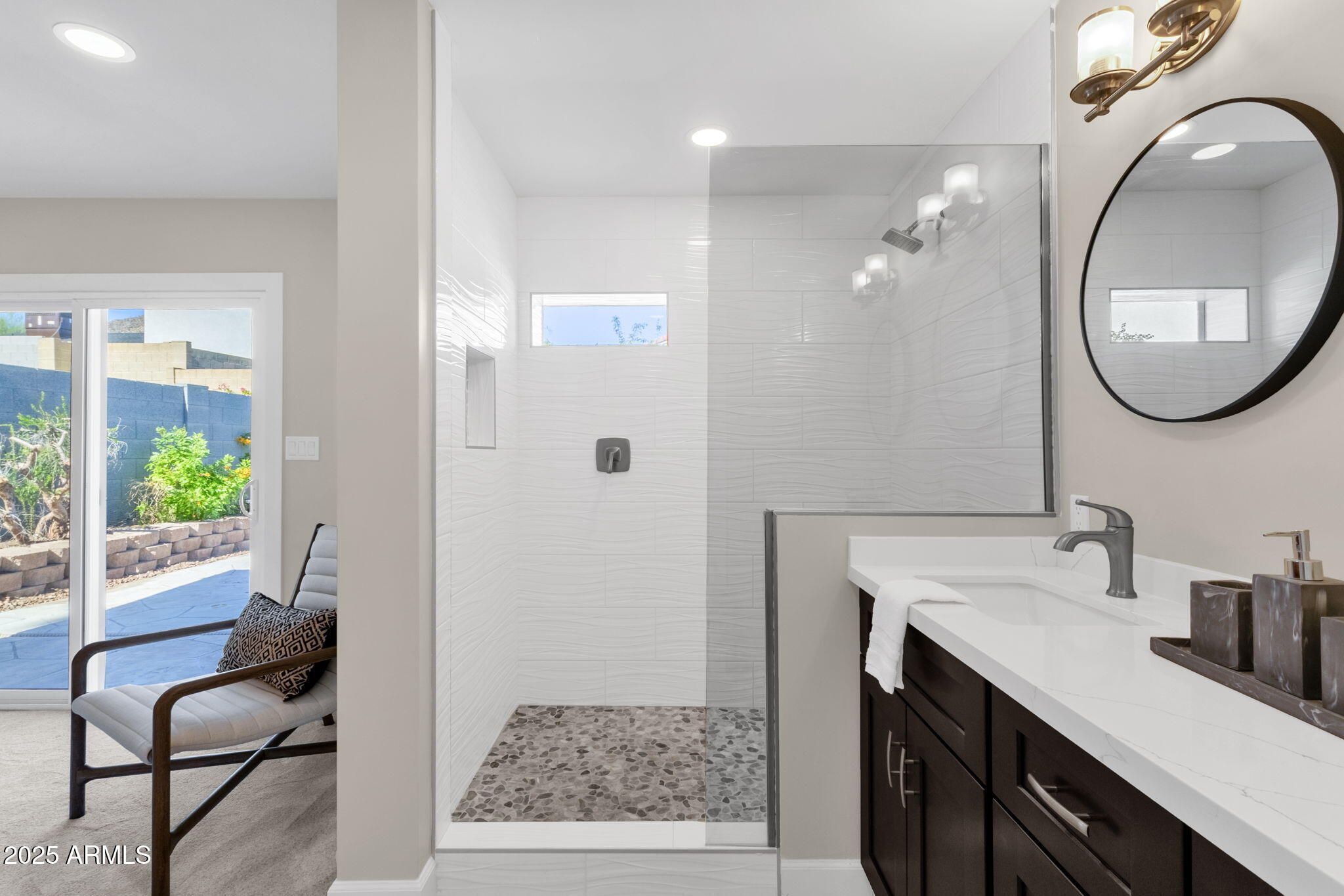 2276 East Mercer Lane Phoenix, AZ 85028 - Photo 52 of 61 a bathroom with a sink a toilet and a mirror
