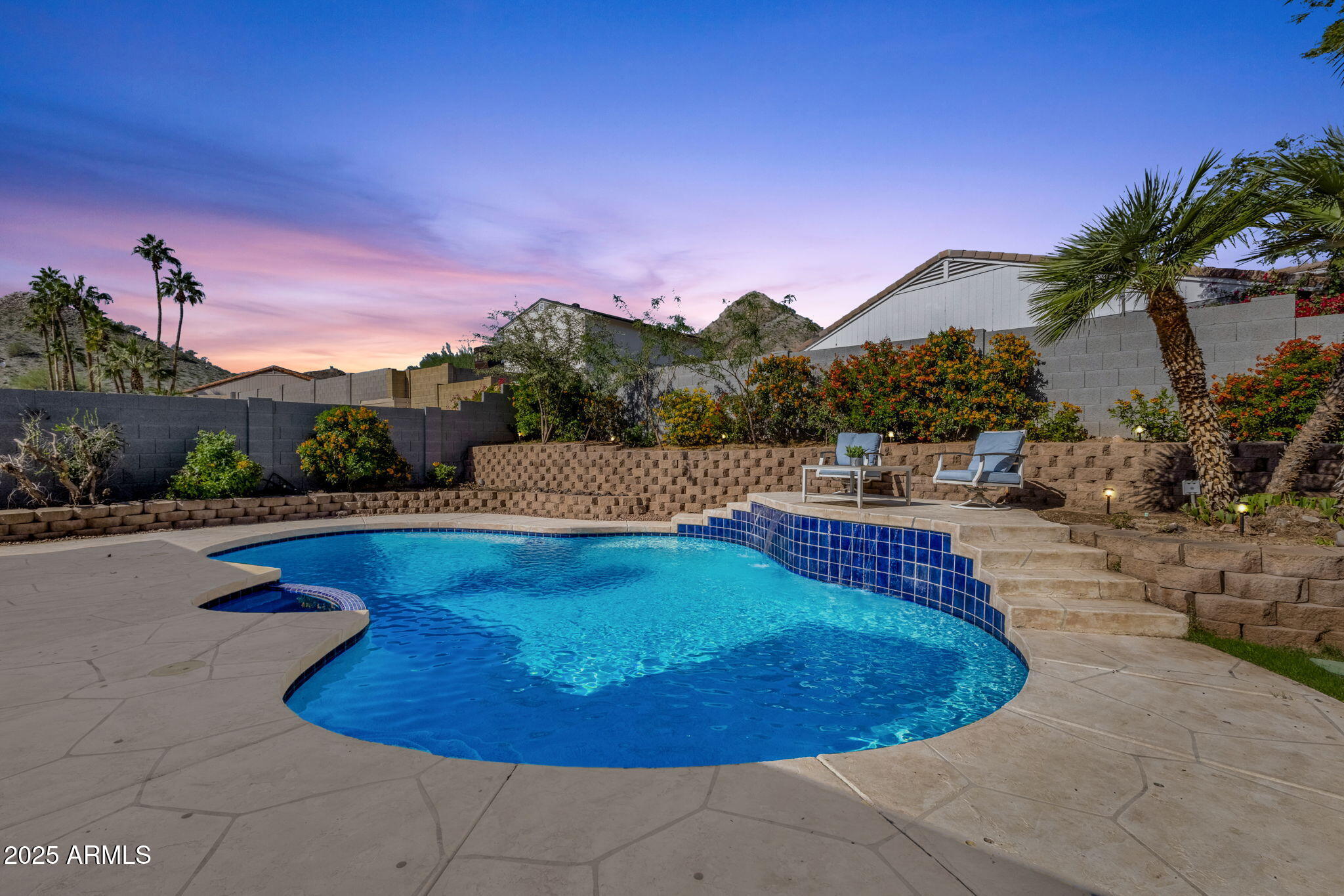 2276 East Mercer Lane Phoenix, AZ 85028 - Photo 56 of 61 a view of a swimming pool with a yard