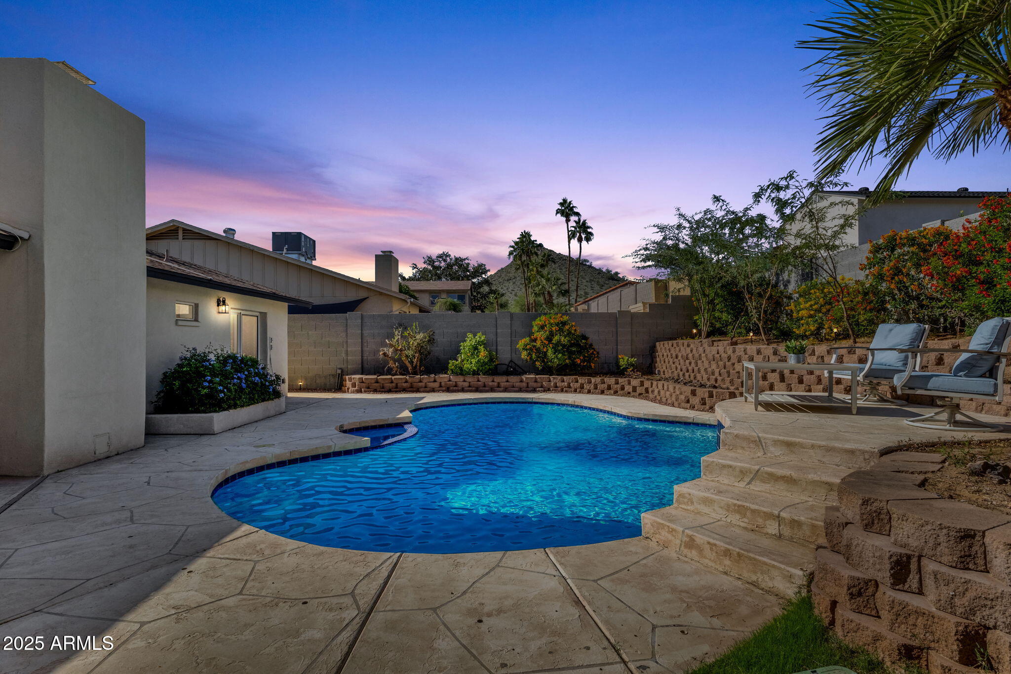 2276 East Mercer Lane Phoenix, AZ 85028 - Photo 57 of 61 a view of a swimming pool with a yard