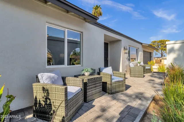 a living room with furniture and a large window