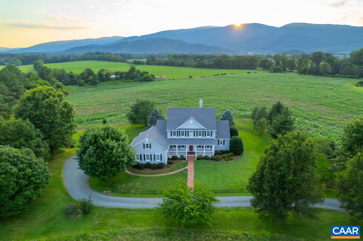 a view of a house with a big yard