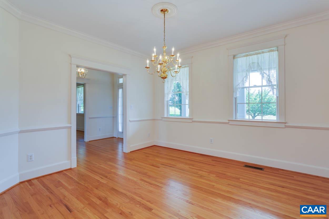 1904 Beaver Ridge Road Crozet, VA 22932 - Photo 12 of 70 a view of an empty room with wooden floor and a window
