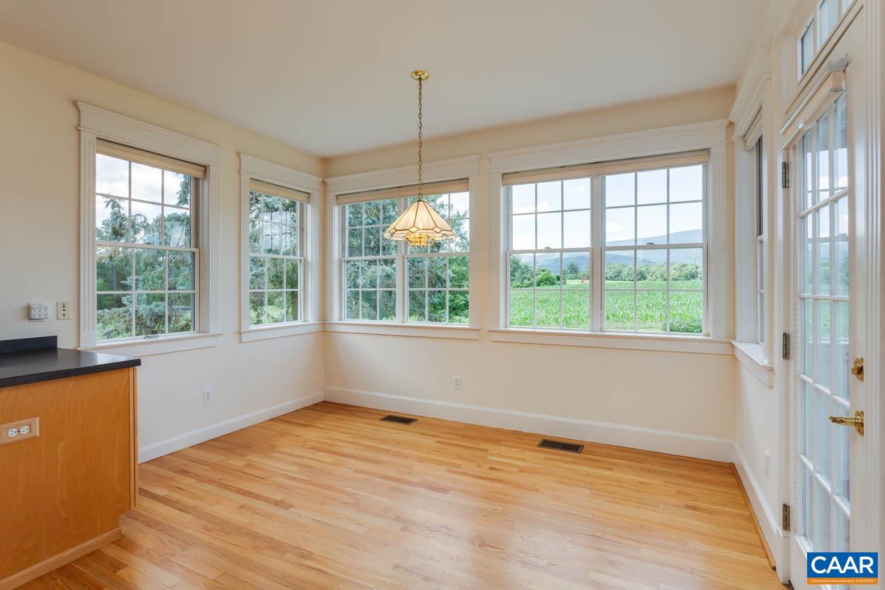 1904 Beaver Ridge Road Crozet, VA 22932 - Photo 19 of 70 a view of an empty room with a window and wooden floor