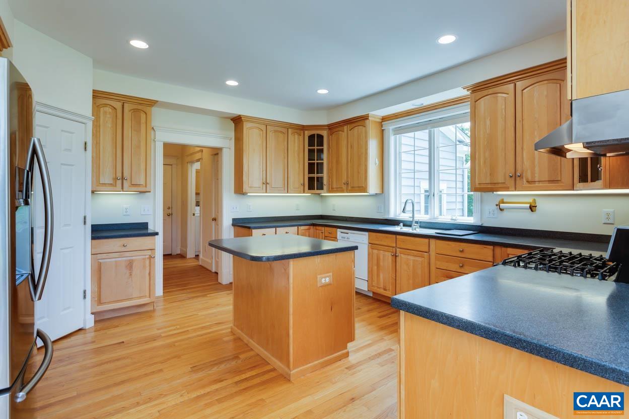 1904 Beaver Ridge Road Crozet, VA 22932 - Photo 20 of 70 a kitchen with stainless steel appliances granite countertop a refrigerator a sink and a stove