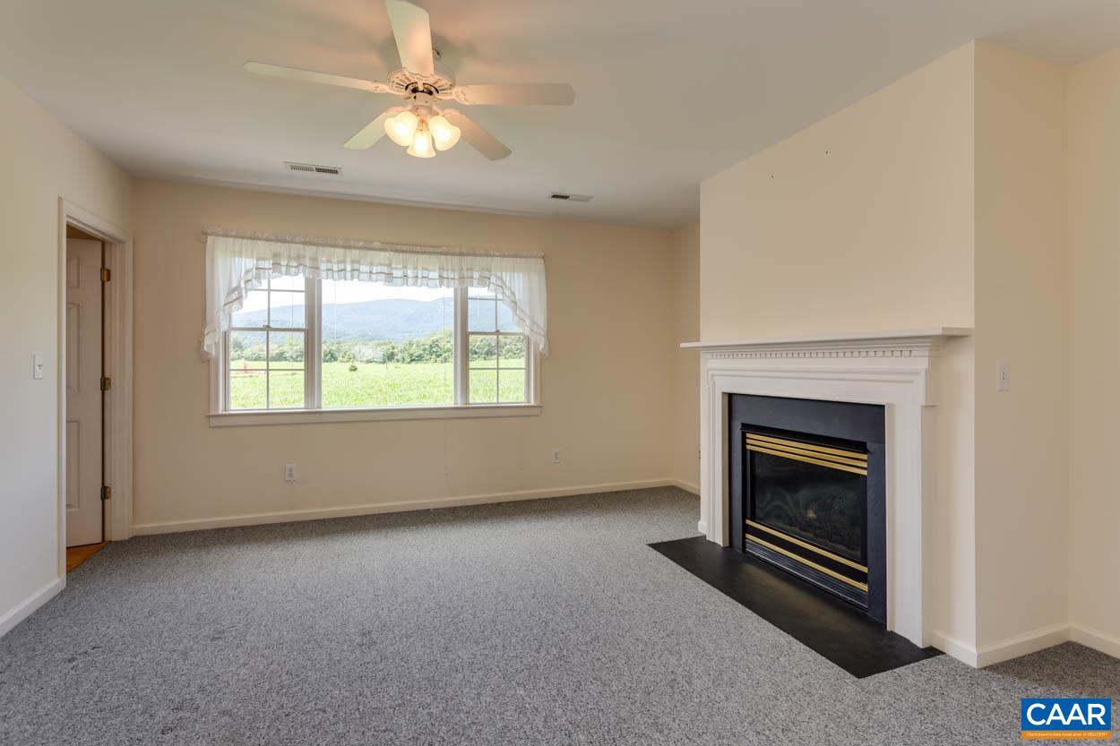 1904 Beaver Ridge Road Crozet, VA 22932 - Photo 32 of 70 an empty room with windows and fireplace