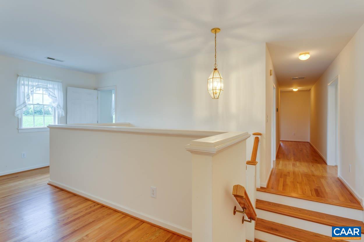 1904 Beaver Ridge Road Crozet, VA 22932 - Photo 43 of 70 a view of an empty room with wooden floor and a window