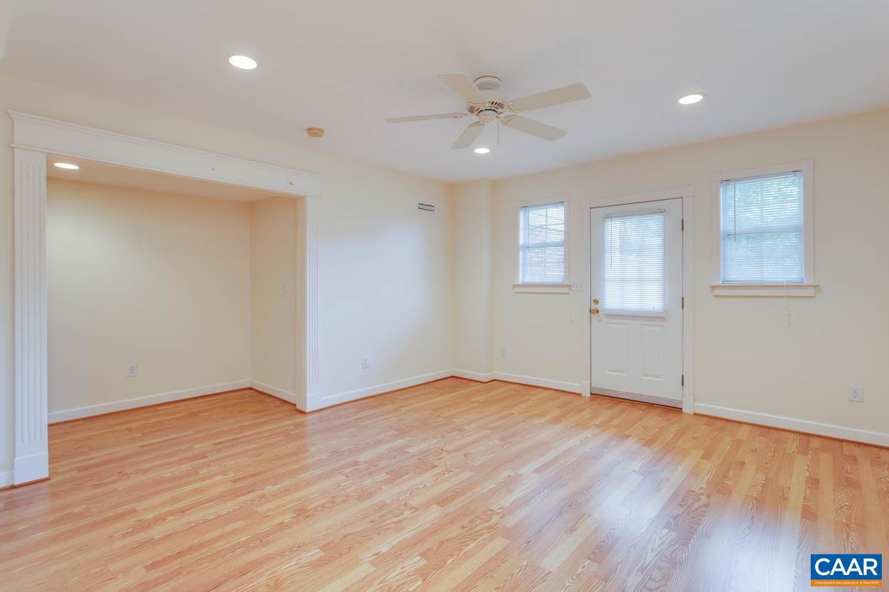 1904 Beaver Ridge Road Crozet, VA 22932 - Photo 44 of 70 a view of an empty room with wooden floor and a window