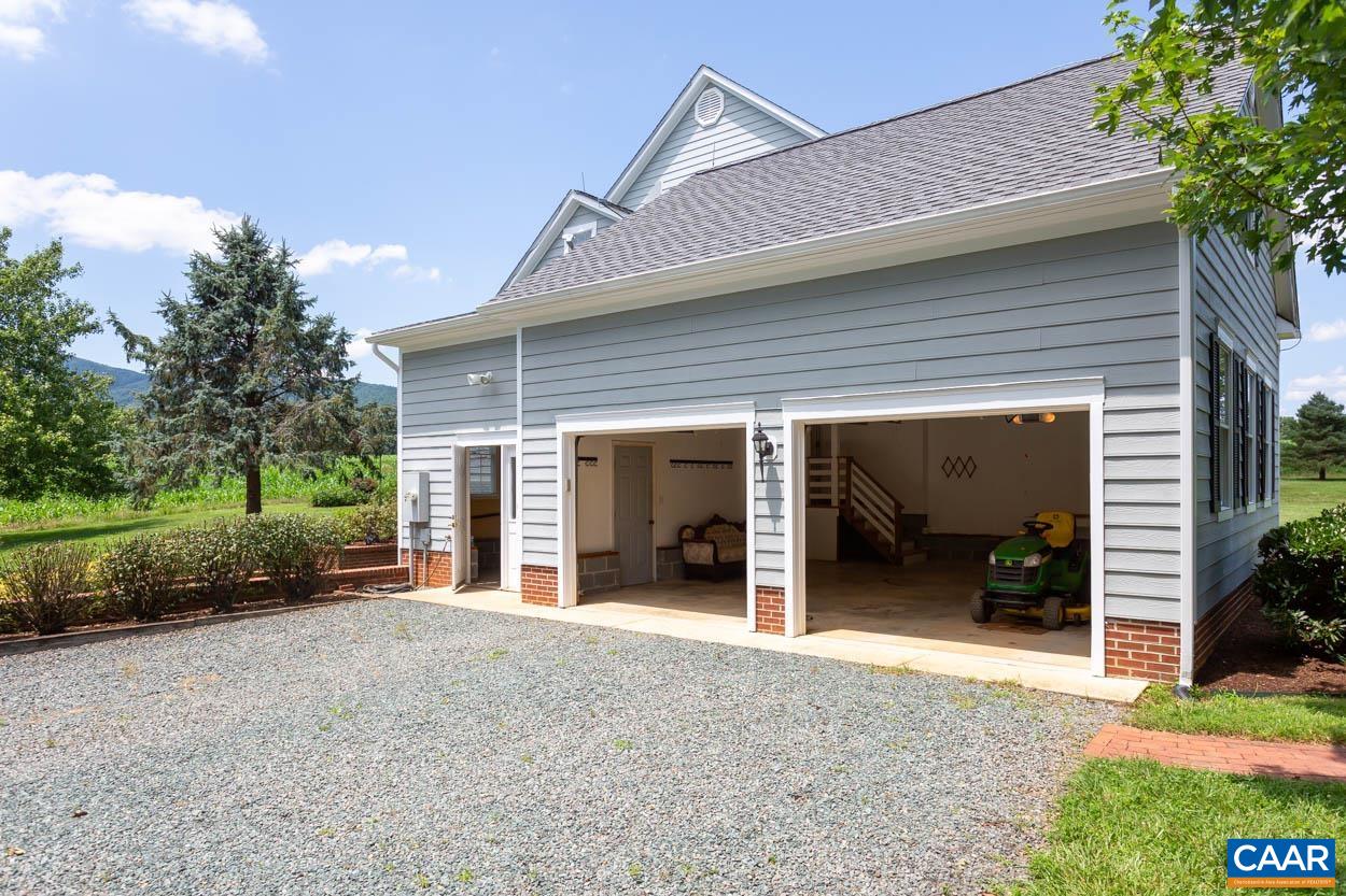 1904 Beaver Ridge Road Crozet, VA 22932 - Photo 49 of 70 a view of a house with a backyard and porch