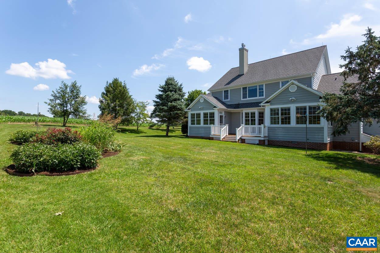 1904 Beaver Ridge Road Crozet, VA 22932 - Photo 55 of 70 a front view of a house with a yard and potted plants