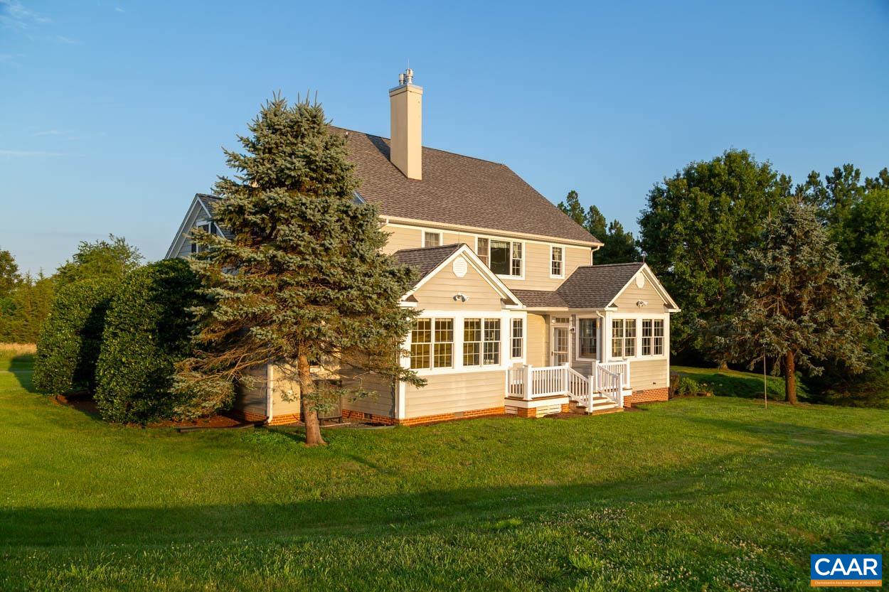 1904 Beaver Ridge Road Crozet, VA 22932 - Photo 6 of 70 a front view of a house with a garden and trees