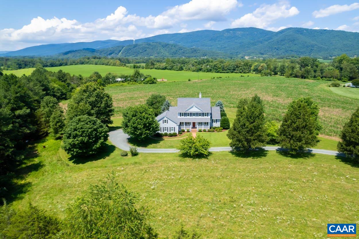 1904 Beaver Ridge Road Crozet, VA 22932 - Photo 61 of 70 a view of a lush green hillside and a houses