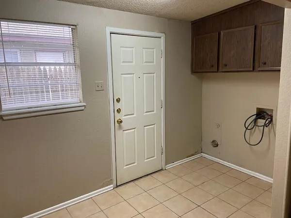 a bathroom with a granite countertop mirror and a sink