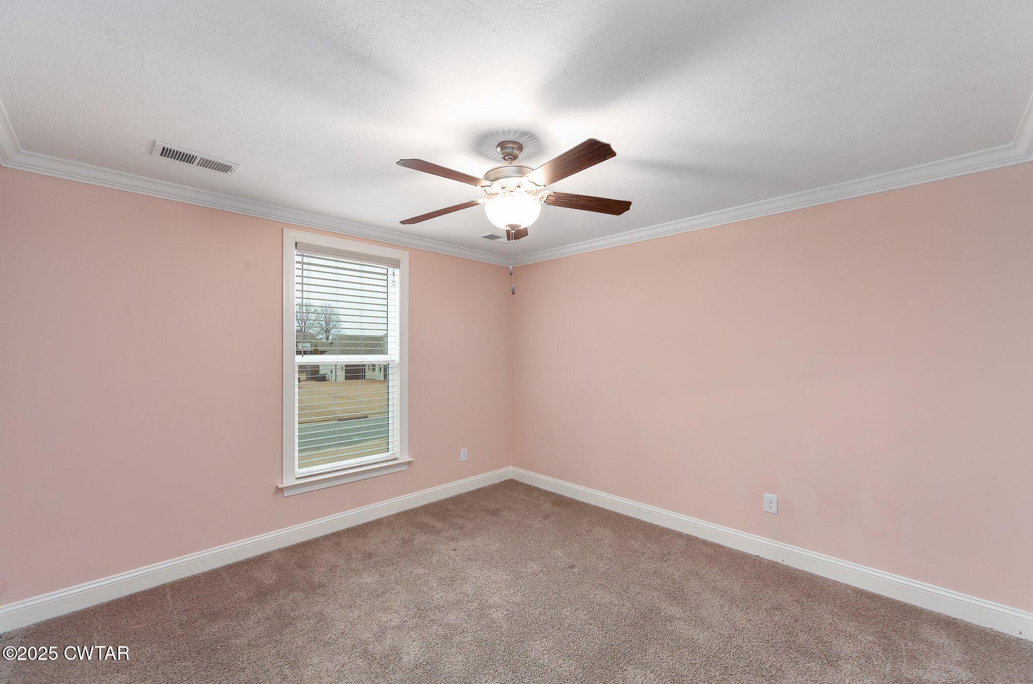 42 Lancaster Cove Jackson, TN 38305 - Photo 15 of 44 an empty room with windows and ceiling fan