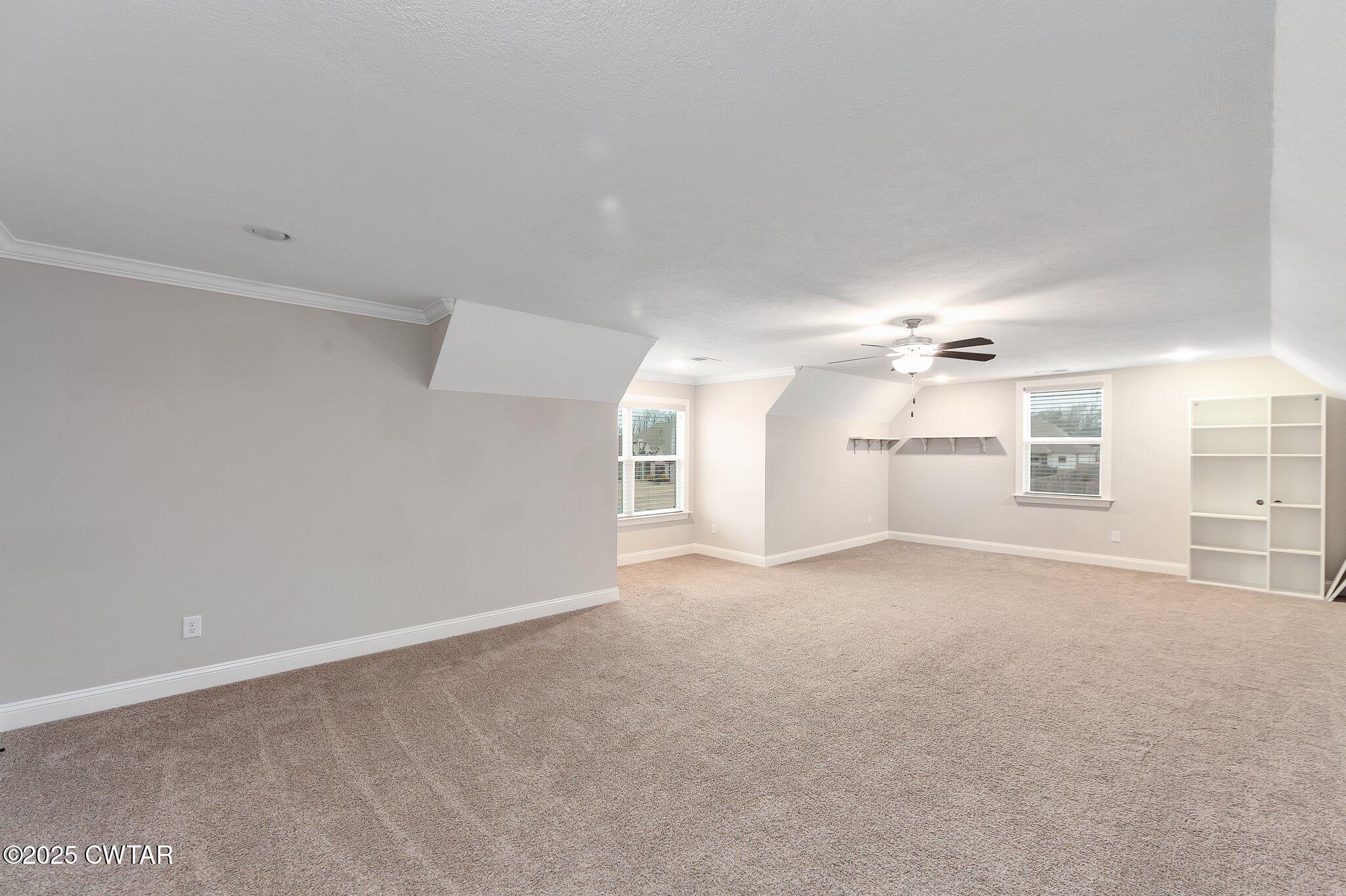 42 Lancaster Cove Jackson, TN 38305 - Photo 16 of 44 en empty room with windows and fireplace