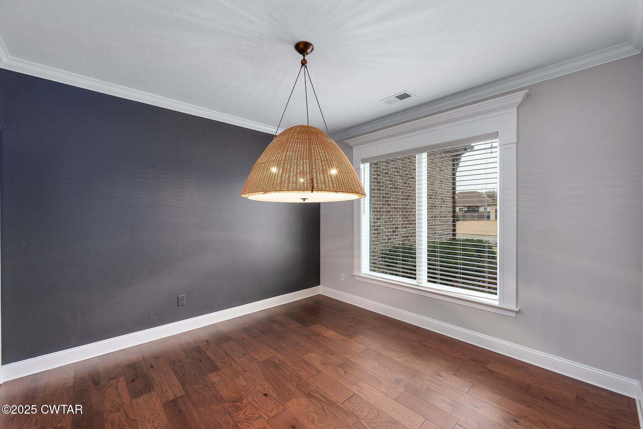 42 Lancaster Cove Jackson, TN 38305 - Photo 21 of 44 a window in a room with wooden floor