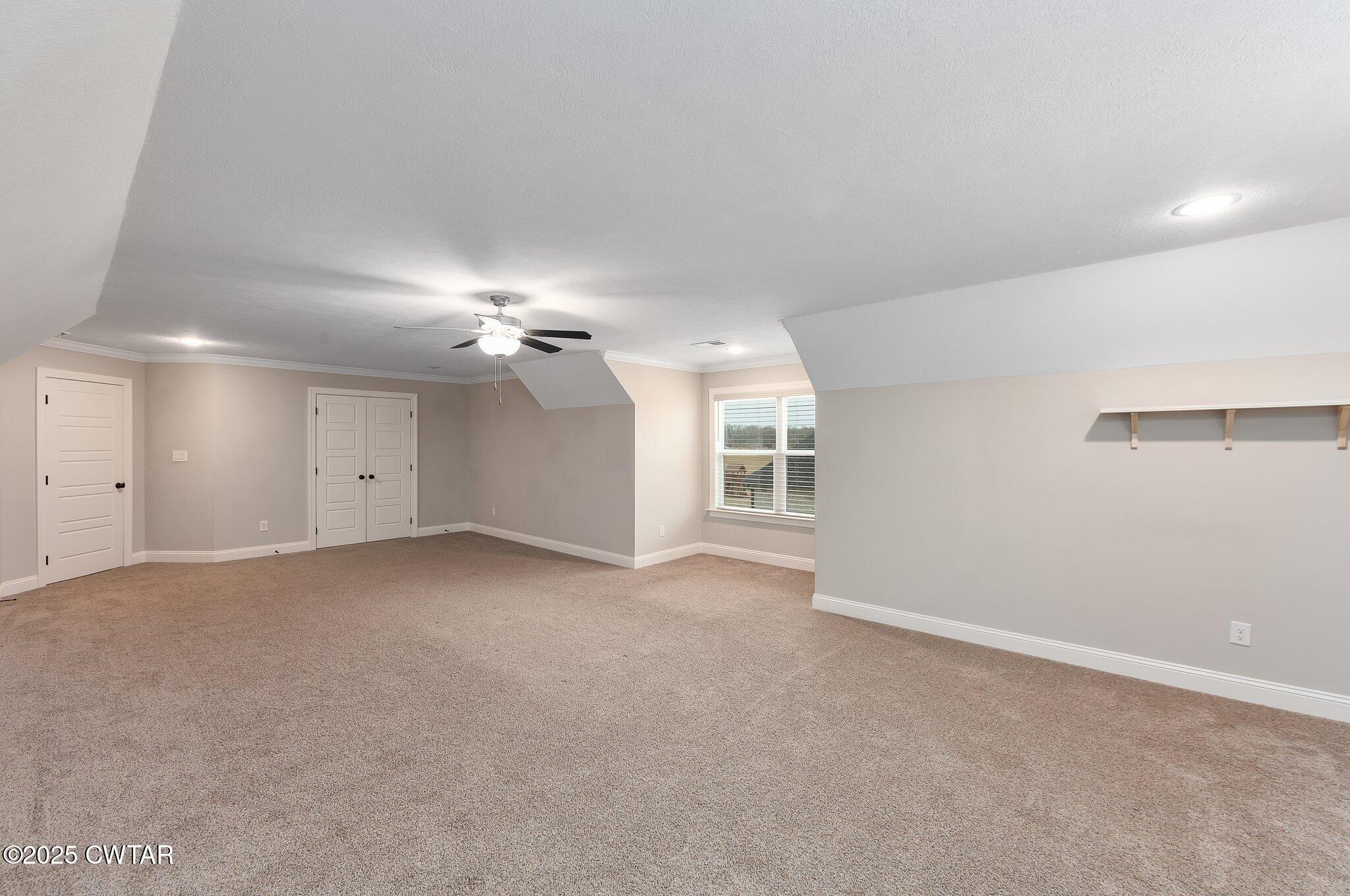 42 Lancaster Cove Jackson, TN 38305 - Photo 38 of 44 a view of a big room with windows and chandelier fan