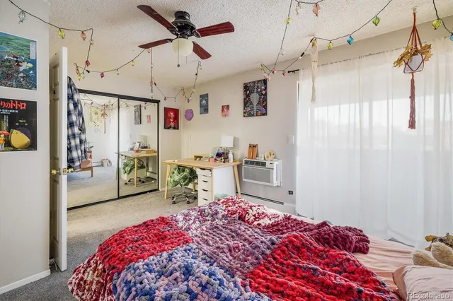 a bedroom with a bed dresser and a window