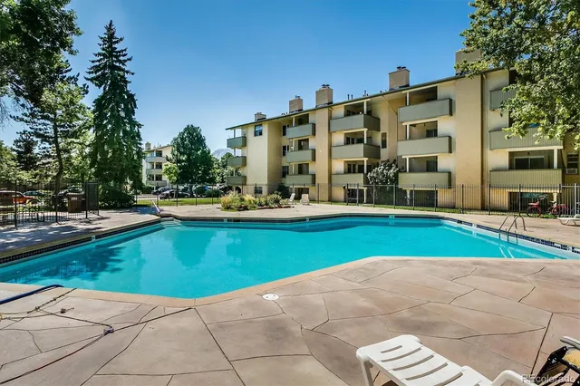 a view of swimming pool with a patio
