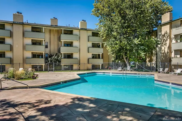 a view of a house with lounge chair and dinning table