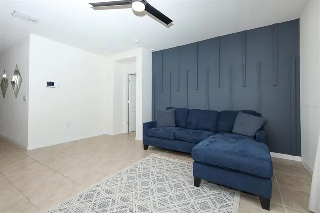 a living room with furniture and a rug