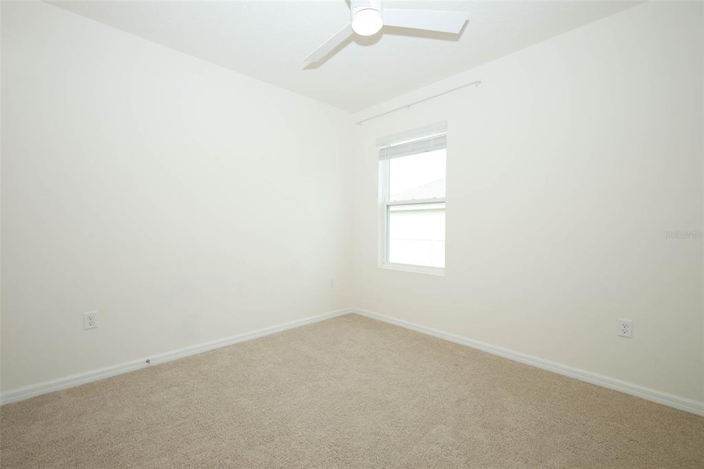 33417 Affirmed Way Sorrento, FL 32776 - Photo 24 of 43 an empty room with a window and a fan