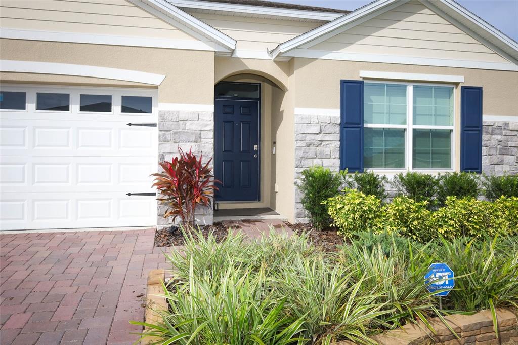 33417 Affirmed Way Sorrento, FL 32776 - Photo 3 of 43 a front view of a house with garden