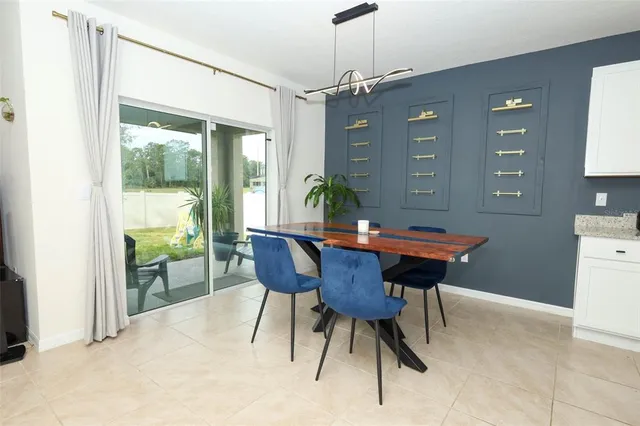 a view of a dining room with furniture window and outside view