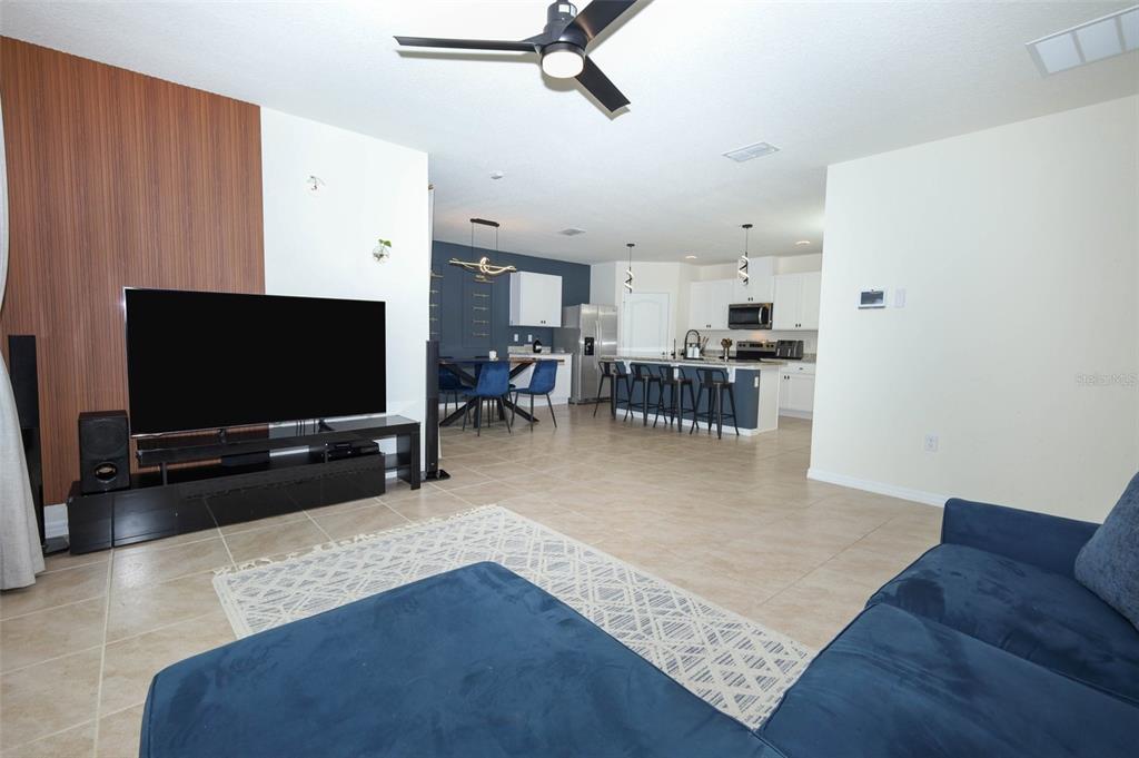33417 Affirmed Way Sorrento, FL 32776 - Photo 10 of 43 a living room with furniture and a flat screen tv