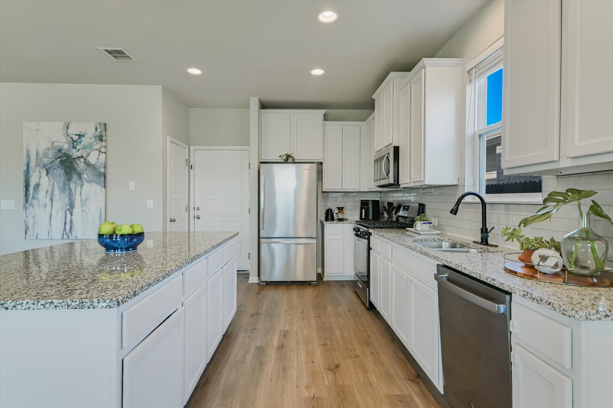 6304 Gunflint Drive Austin, TX 78747 - Photo 10 of 28 A kitchen that actually inspires you to cook, granite counters, stainless appliances, and room to move.