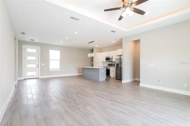 a view of a kitchen with a sink and a window
