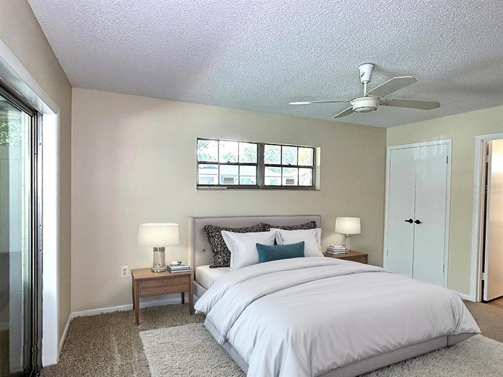 4791 Deer Road Orlando, FL 32812 - Photo 15 of 35 a bedroom with a bed and a chandelier