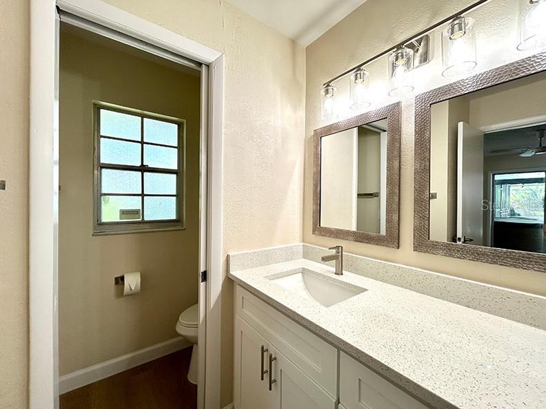 4791 Deer Road Orlando, FL 32812 - Photo 20 of 35 a bathroom with a sink and a window