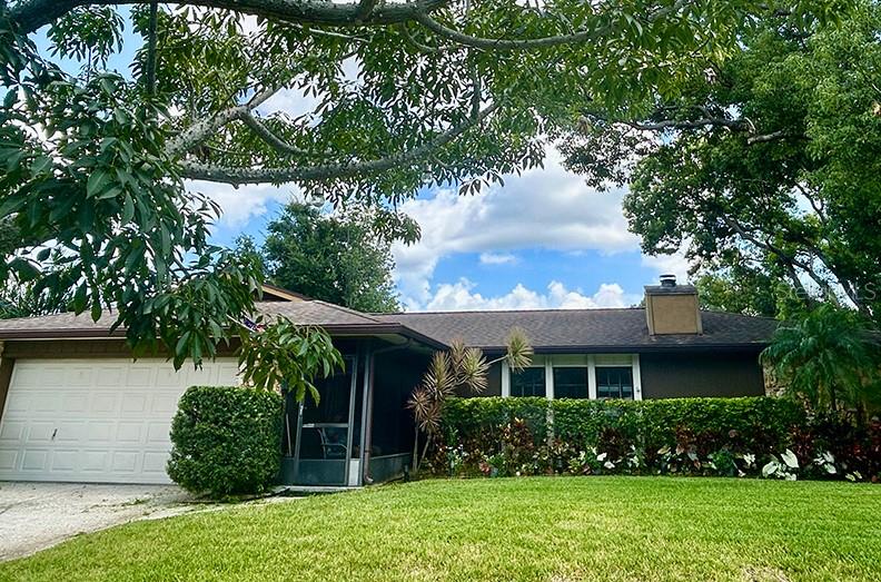 4791 Deer Road Orlando, FL 32812 - Photo 2 of 35 front view of a house with a garden