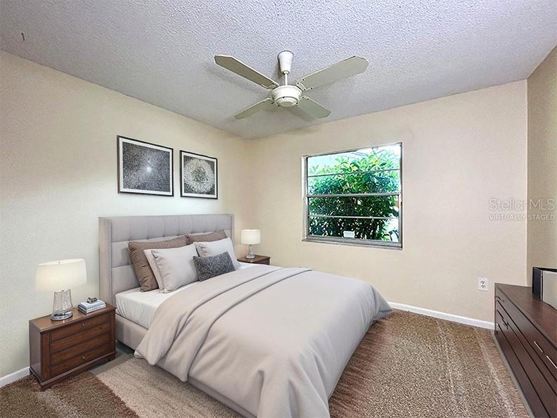 4791 Deer Road Orlando, FL 32812 - Photo 23 of 35 a bedroom with a large bed and a window