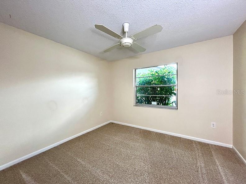 4791 Deer Road Orlando, FL 32812 - Photo 24 of 35 an empty room with windows and fan