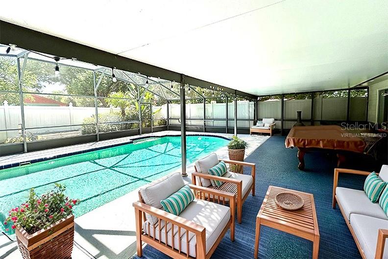 4791 Deer Road Orlando, FL 32812 - Photo 29 of 35 a living room with furniture and a floor to ceiling window