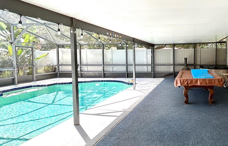 4791 Deer Road Orlando, FL 32812 - Photo 30 of 35 a swimming pool with outdoor seating and yard