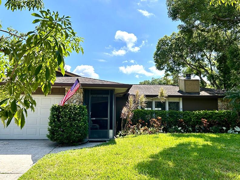 4791 Deer Road Orlando, FL 32812 - Photo 33 of 35 a front view of a house with a yard