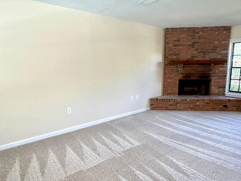 4791 Deer Road Orlando, FL 32812 - Photo 6 of 35 a view of a fireplace with wooden floor