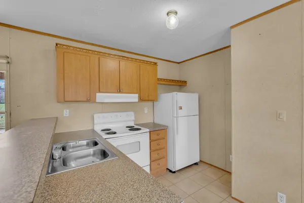 a room with furniture a washer and dryer