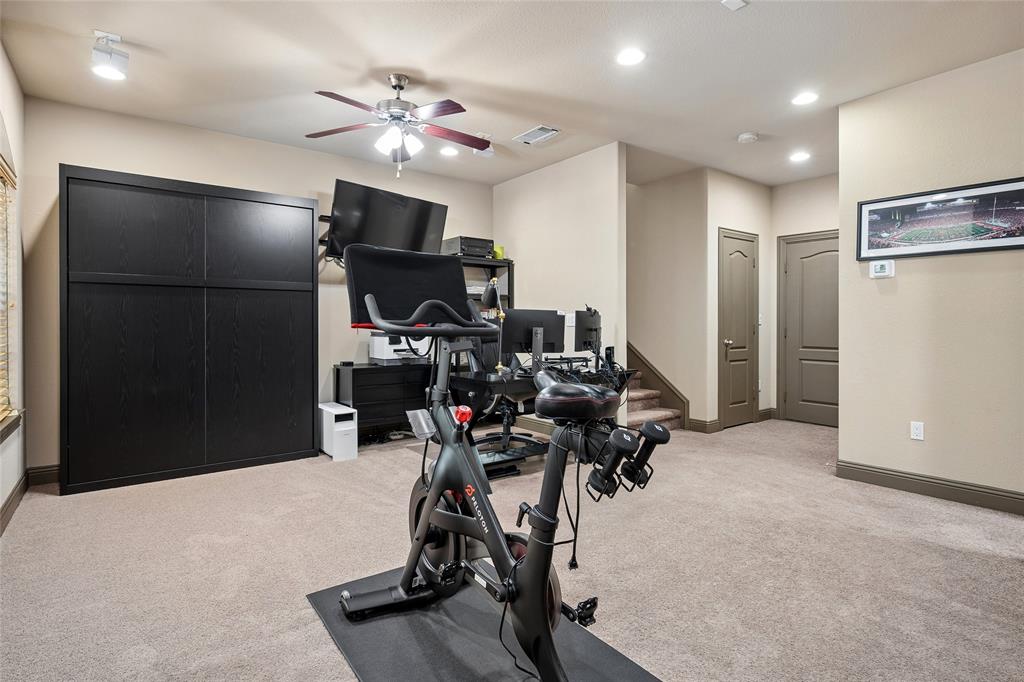 835 Rockingham Drive Irving, TX 75063 - Photo 19 of 27 a view of a room with gym equipment
