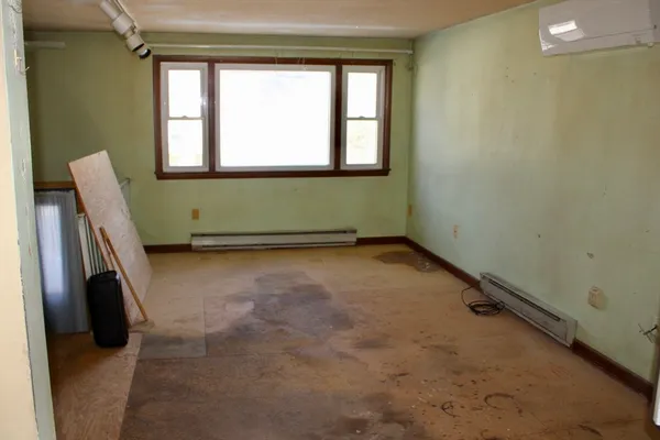 a room with a chair and a window