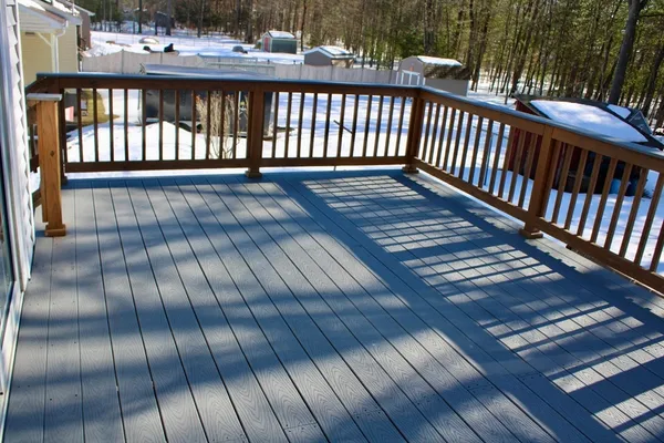 a view of a balcony with wooden floor